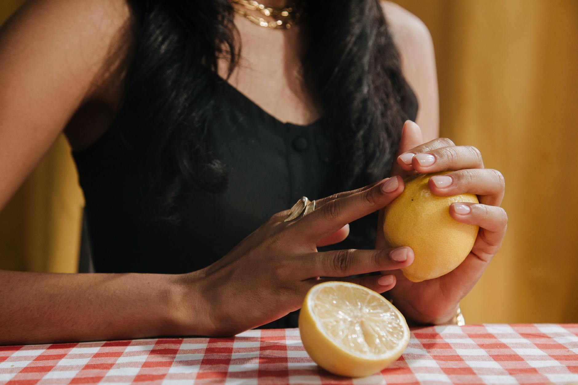 Hands holding a sleek blue vibrator in an intimate moment, showing comfort and connection.