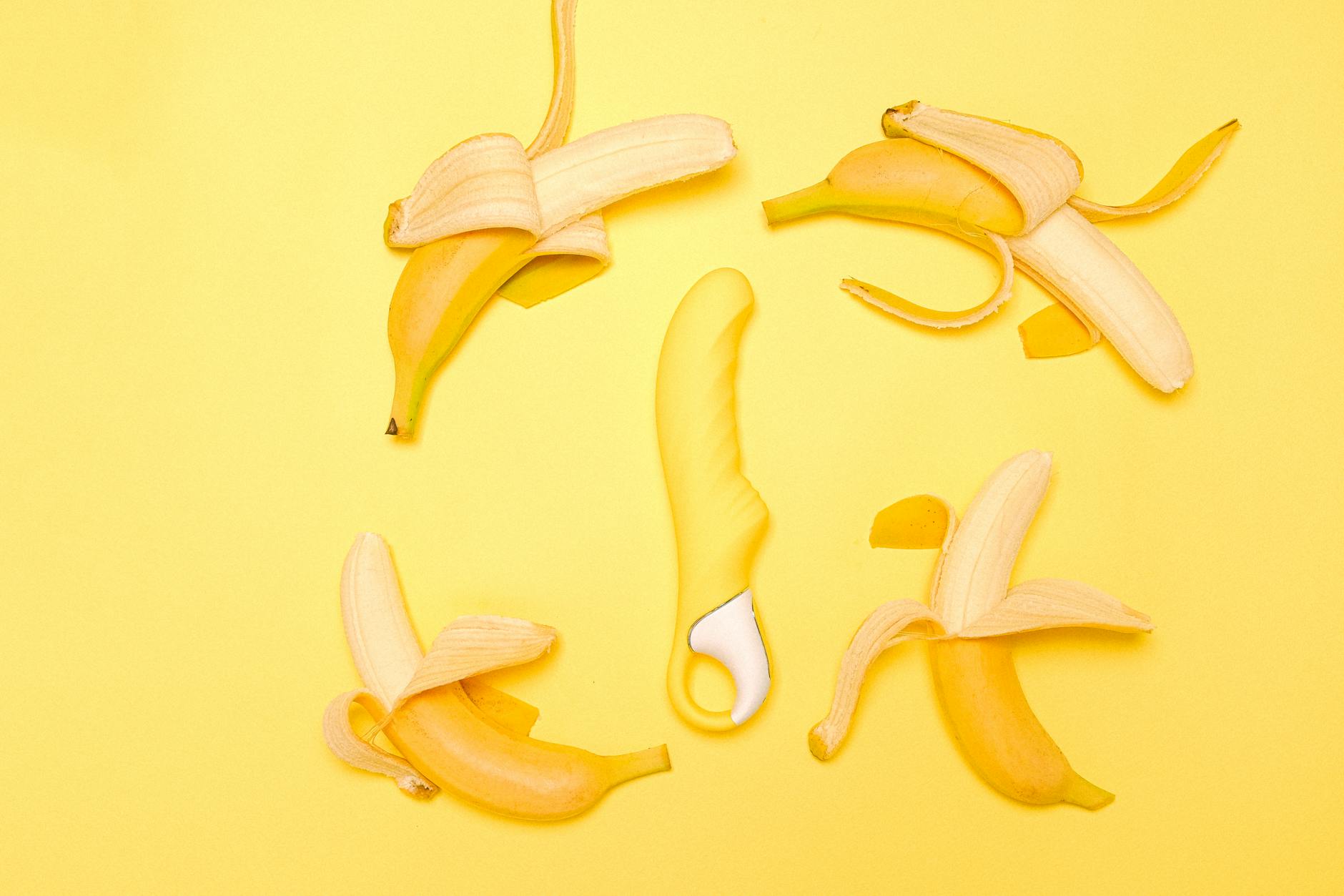 Yellow lemon clitoral vibrator on a bright background symbolizing pleasure and intimacy for couples